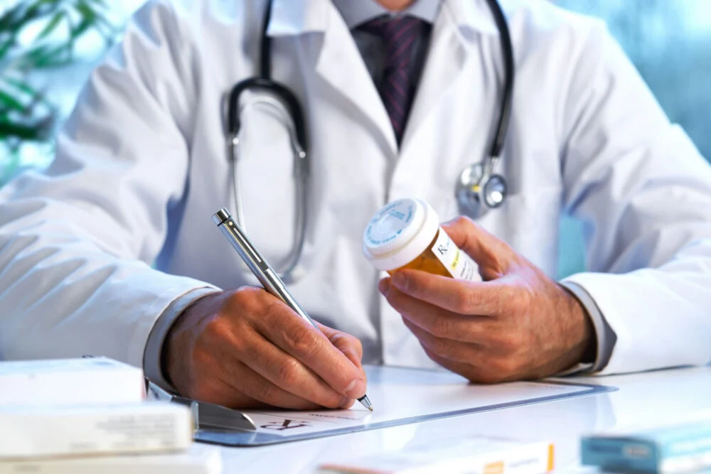 prescription-drug-addiction-recovery doctor reviewing a prescription medication
