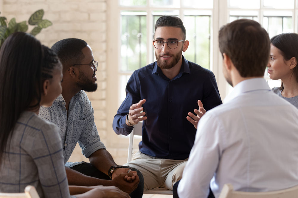 man addressing recovery group