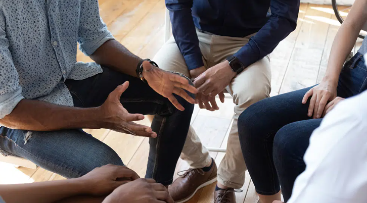 Participants listening and talking during a group addiction therapy session in Jacksonville, Florida Participants listening and talking during a group addiction therapy session in Jacksonville, Florida